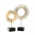 Gold-Tone Sunburst Sculpture on Black Cube Base